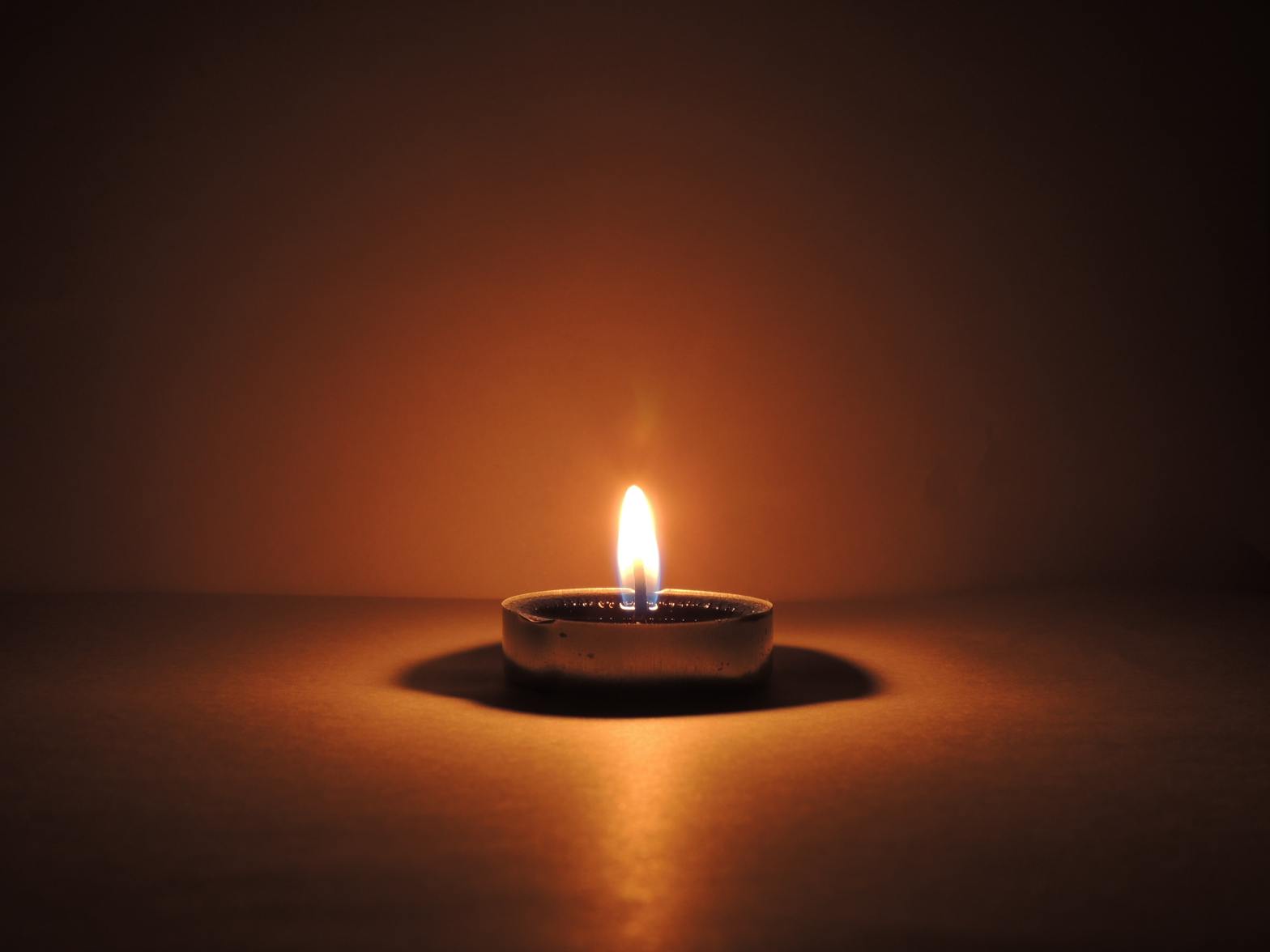 Candle burning in the dark, image by Chirag K